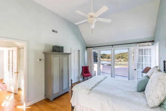 a bed room with a bed and a large window