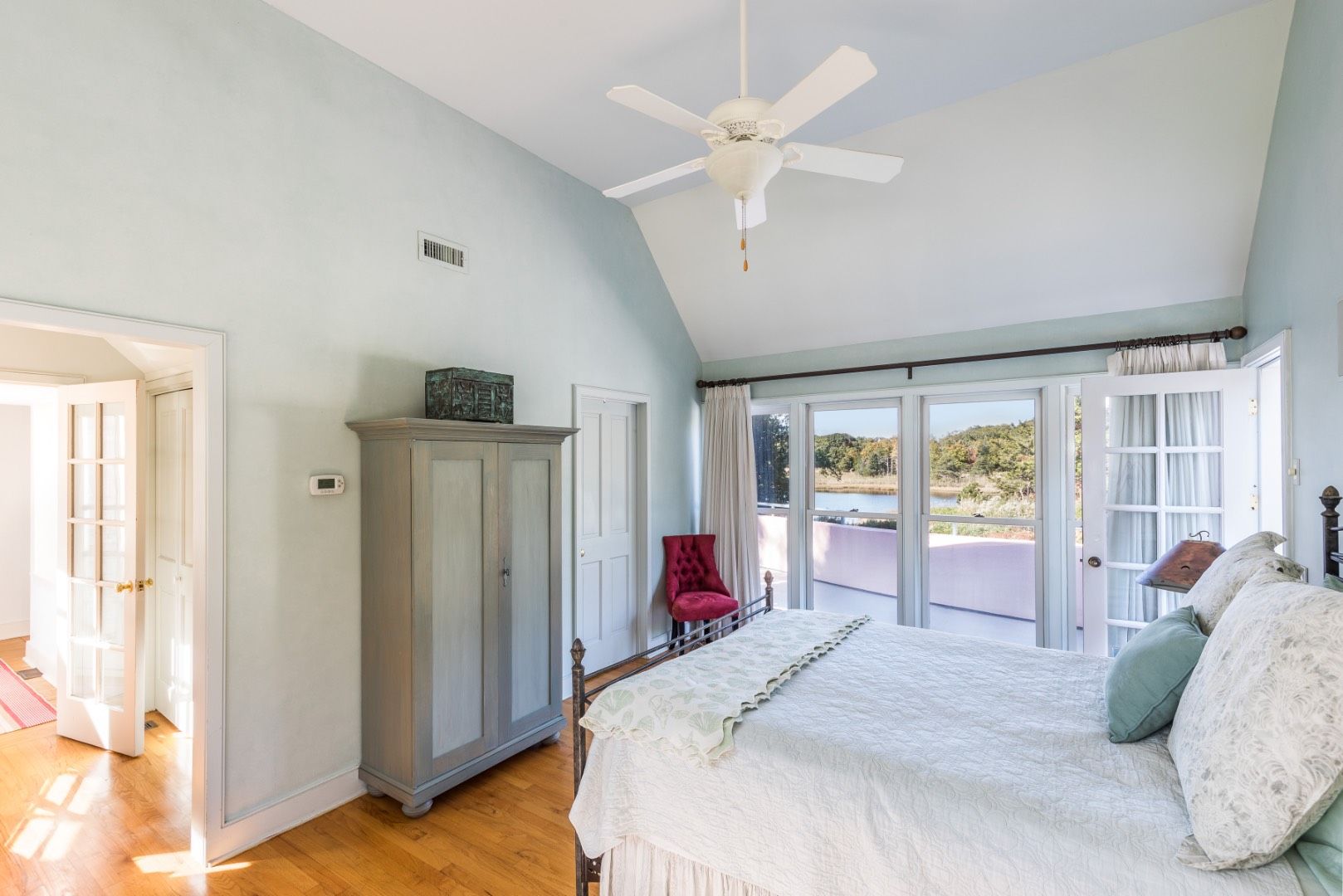 69 Fresh Pond Road Sag Harbor, NY 11963 - Photo 4 of 13 a bed room with a bed and a large window