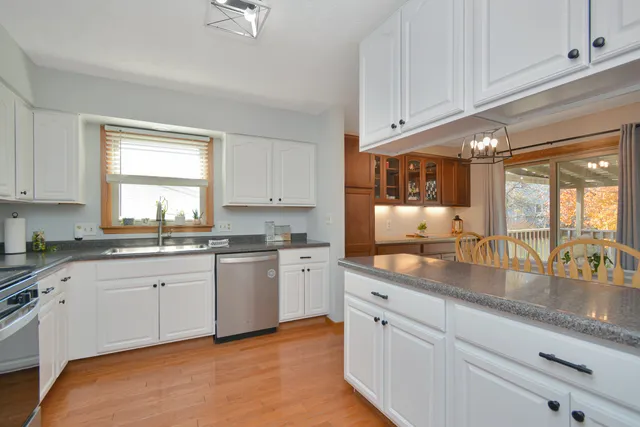 a dining room with furniture and chandelier