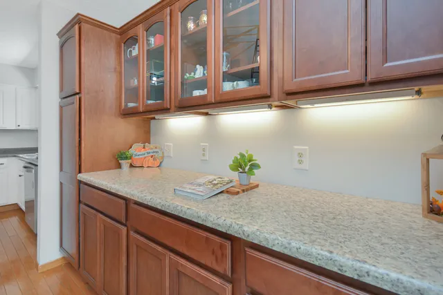 a bedroom with a bed and a night stand