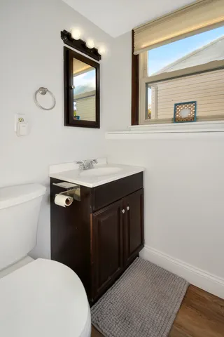 a dining room with furniture and a kitchen view