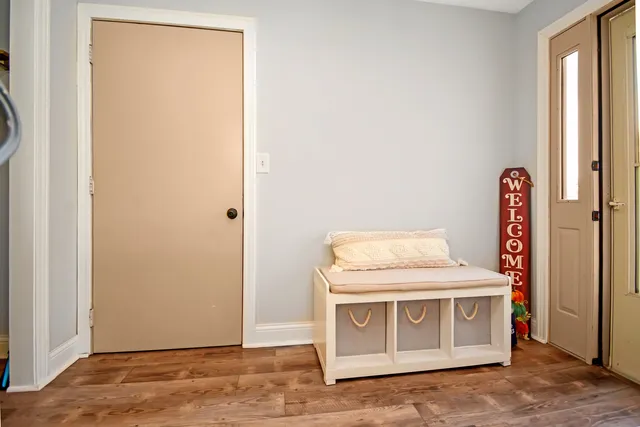 a view of a dining room with furniture wooden floor and chandelier