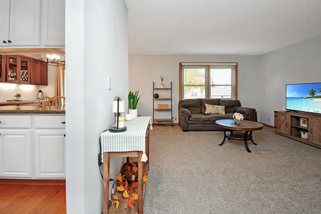 a kitchen with stainless steel appliances granite countertop a sink a stove and cabinets