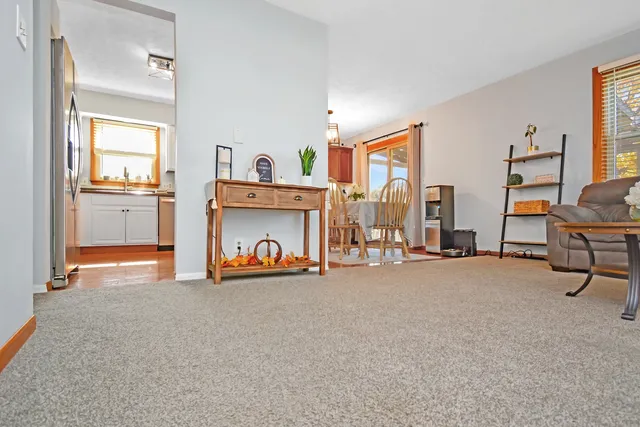 a kitchen with granite countertop a refrigerator stove and sink