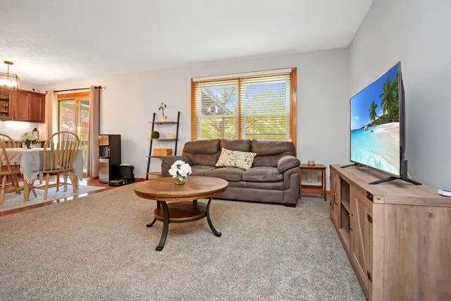 a dining table with kitchen view