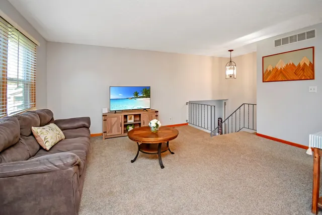 a kitchen with granite countertop a stove and a refrigerator