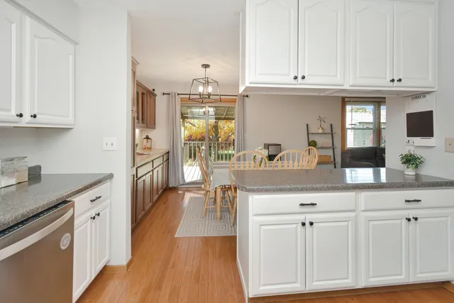 a kitchen with a stove a sink and a microwave