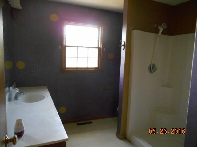 938 Lake Summerset Road Davis, IL 61019 - Photo 15 of 25 a bathroom with a sink and a window