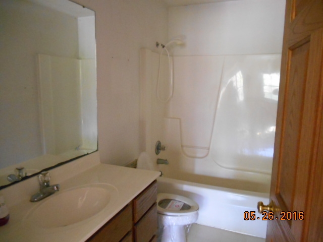 938 Lake Summerset Road Davis, IL 61019 - Photo 16 of 25 a bathroom with a sink and a mirror