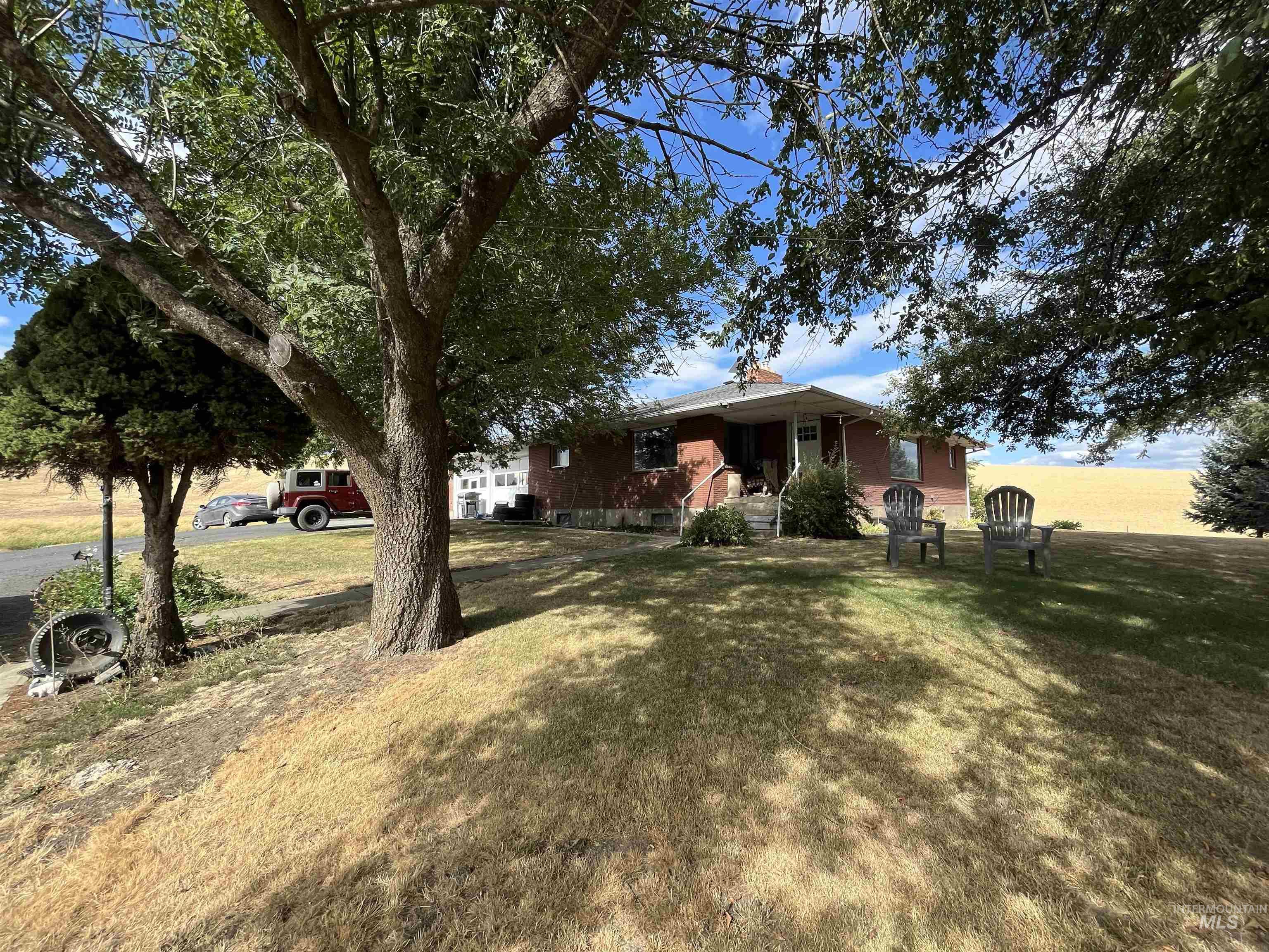 View of side of property with a yard
