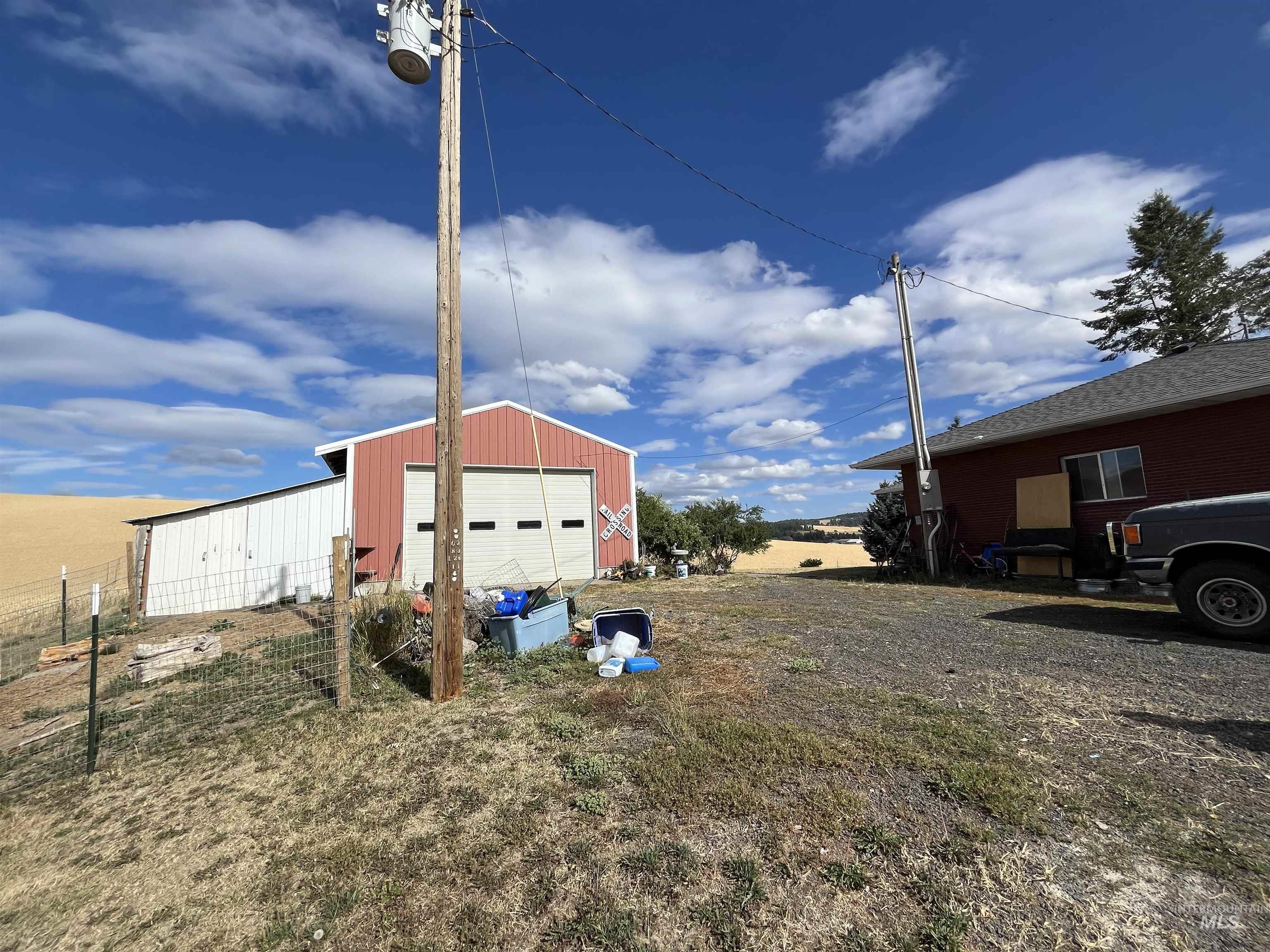 1048 Reynolds Road Princeton, ID 83857 - Photo 21 of 41 Oversized Garage door & Lean-to additional covered area