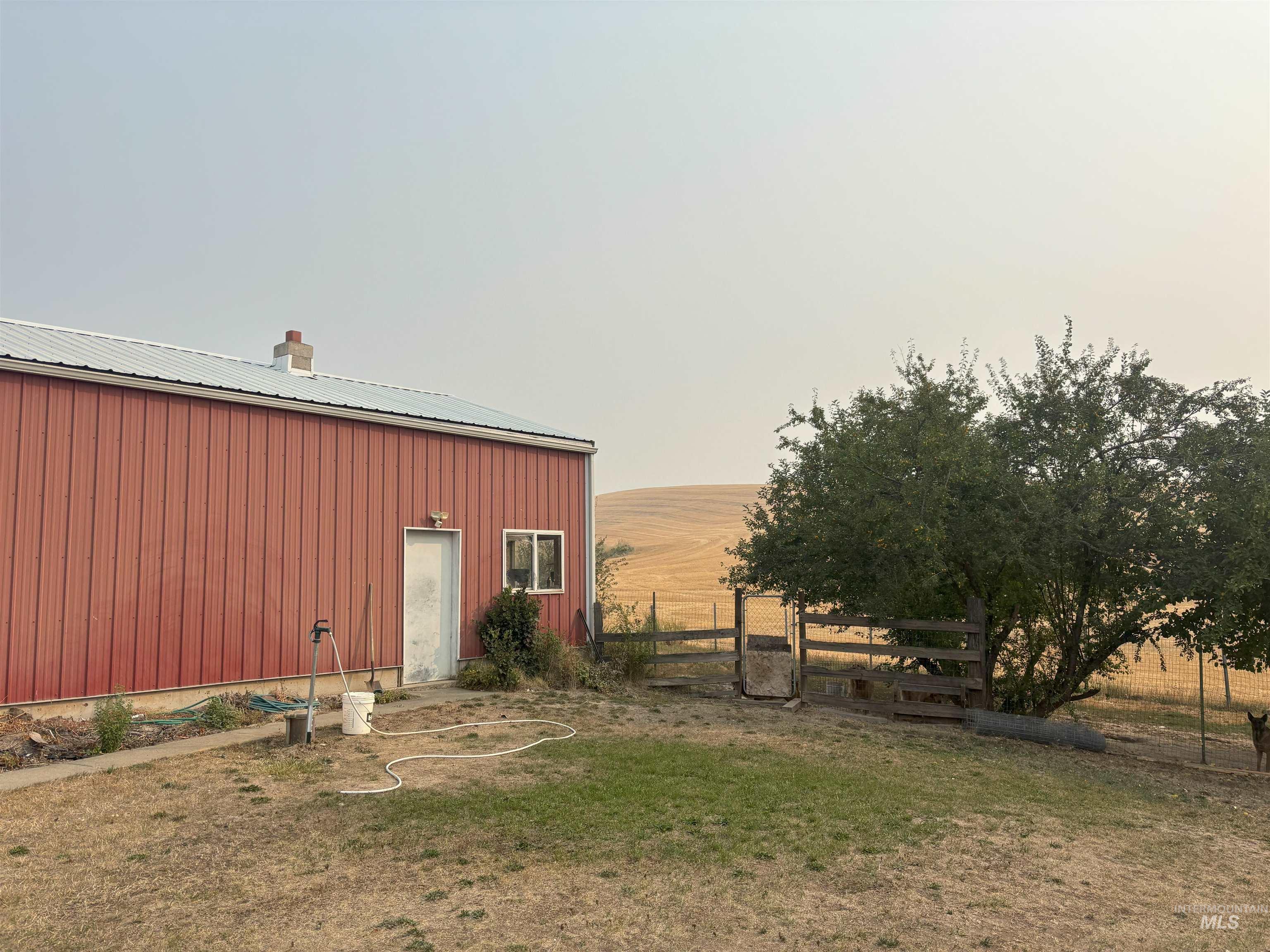 1048 Reynolds Road Princeton, ID 83857 - Photo 23 of 41 View of yard featuring an outbuilding, an outdoor structure, and a rural view