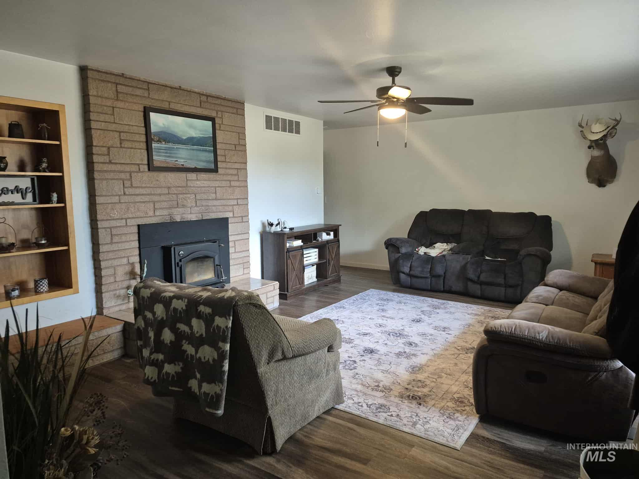 1048 Reynolds Road Princeton, ID 83857 - Photo 3 of 41 Living area with dark wood-type flooring and a ceiling fan