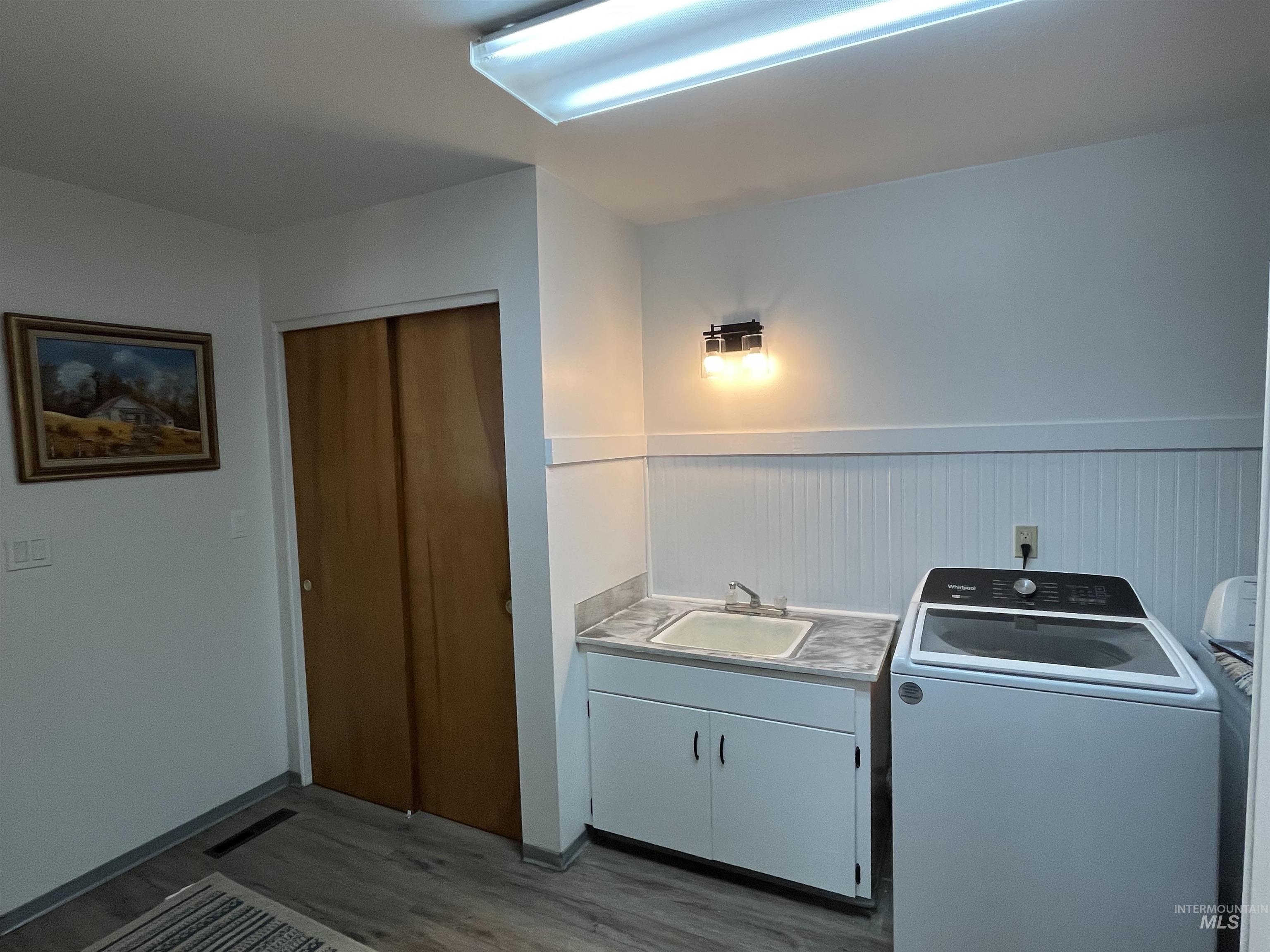 1048 Reynolds Road Princeton, ID 83857 - Photo 10 of 41 Laundry room with washer / dryer on the main level and entry to the garage