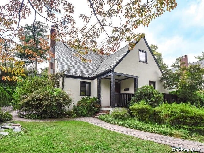 27 Amherst Road Port Washington, NY 11050 - Photo 1 of 1 a front view of house with yard and green space