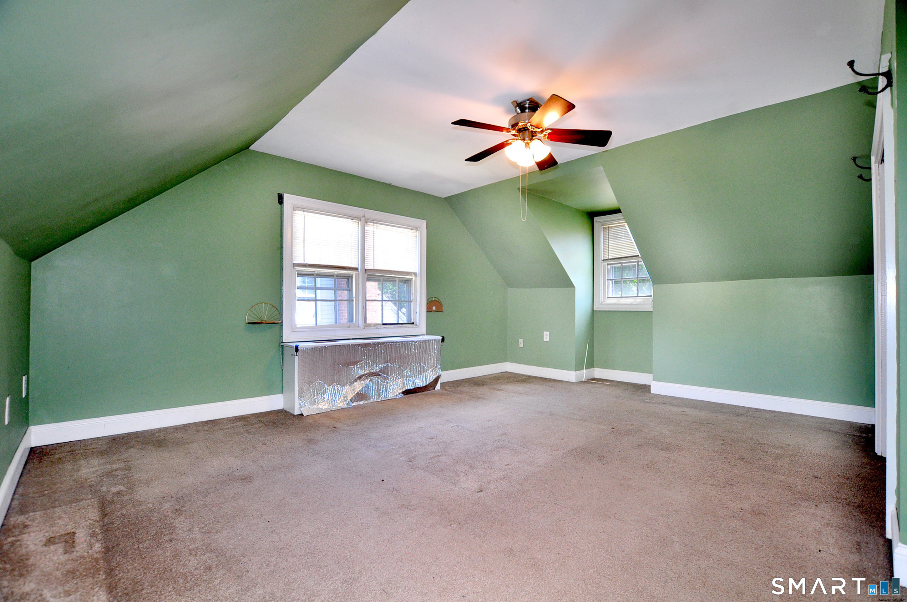 103 West Center Street Manchester, CT 06040 - Photo 26 of 29 a view of an empty room with window and chandelier fan