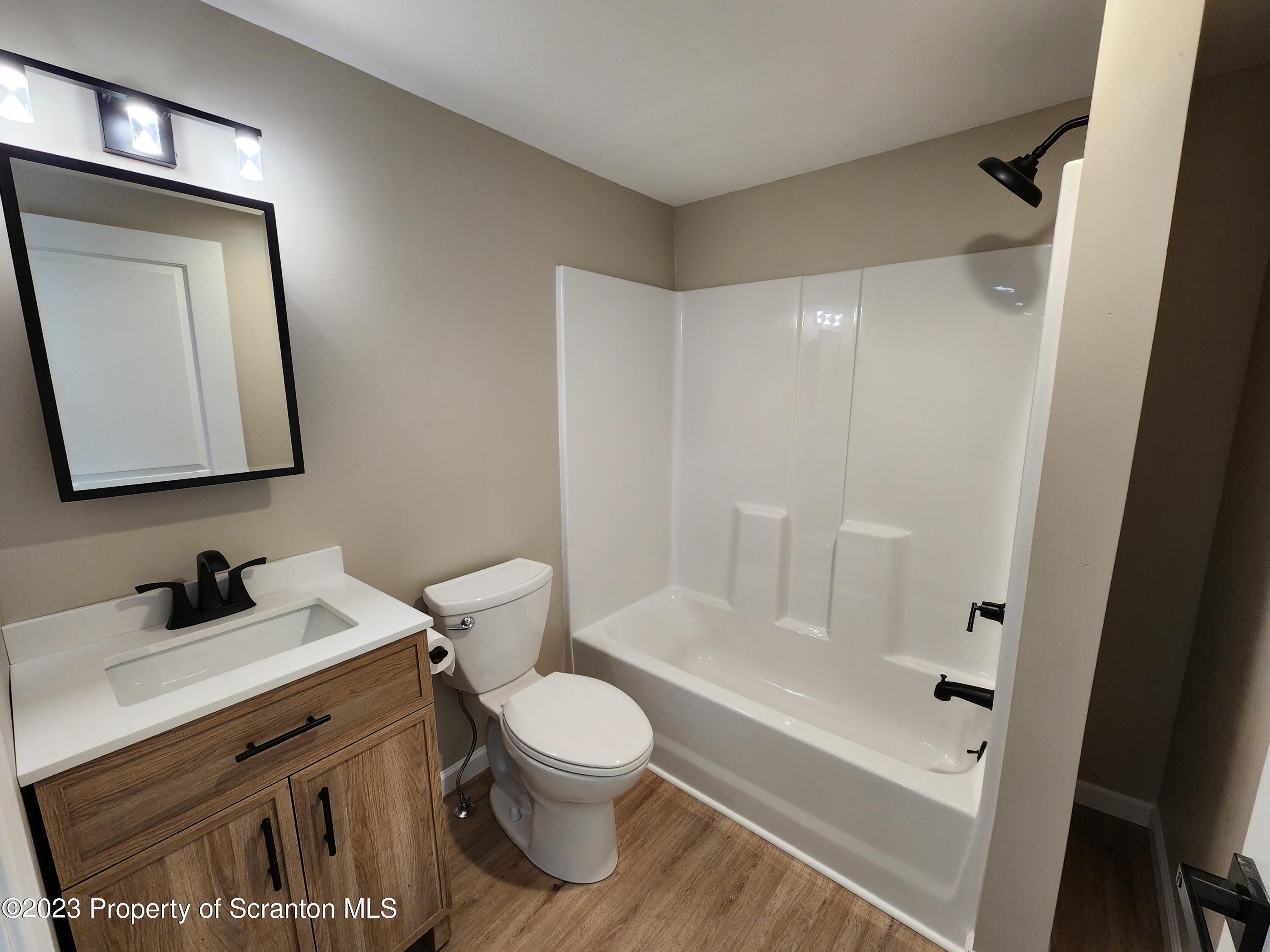 257 Maple Drive Dalton, PA 18414 - Photo 12 of 31 a bathroom with a sink a toilet and shower
