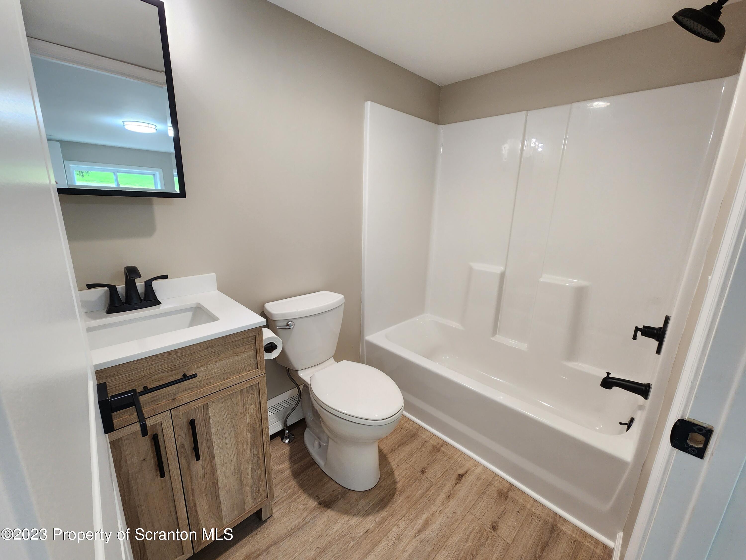 257 Maple Drive Dalton, PA 18414 - Photo 14 of 31 a bathroom with a sink toilet and shower