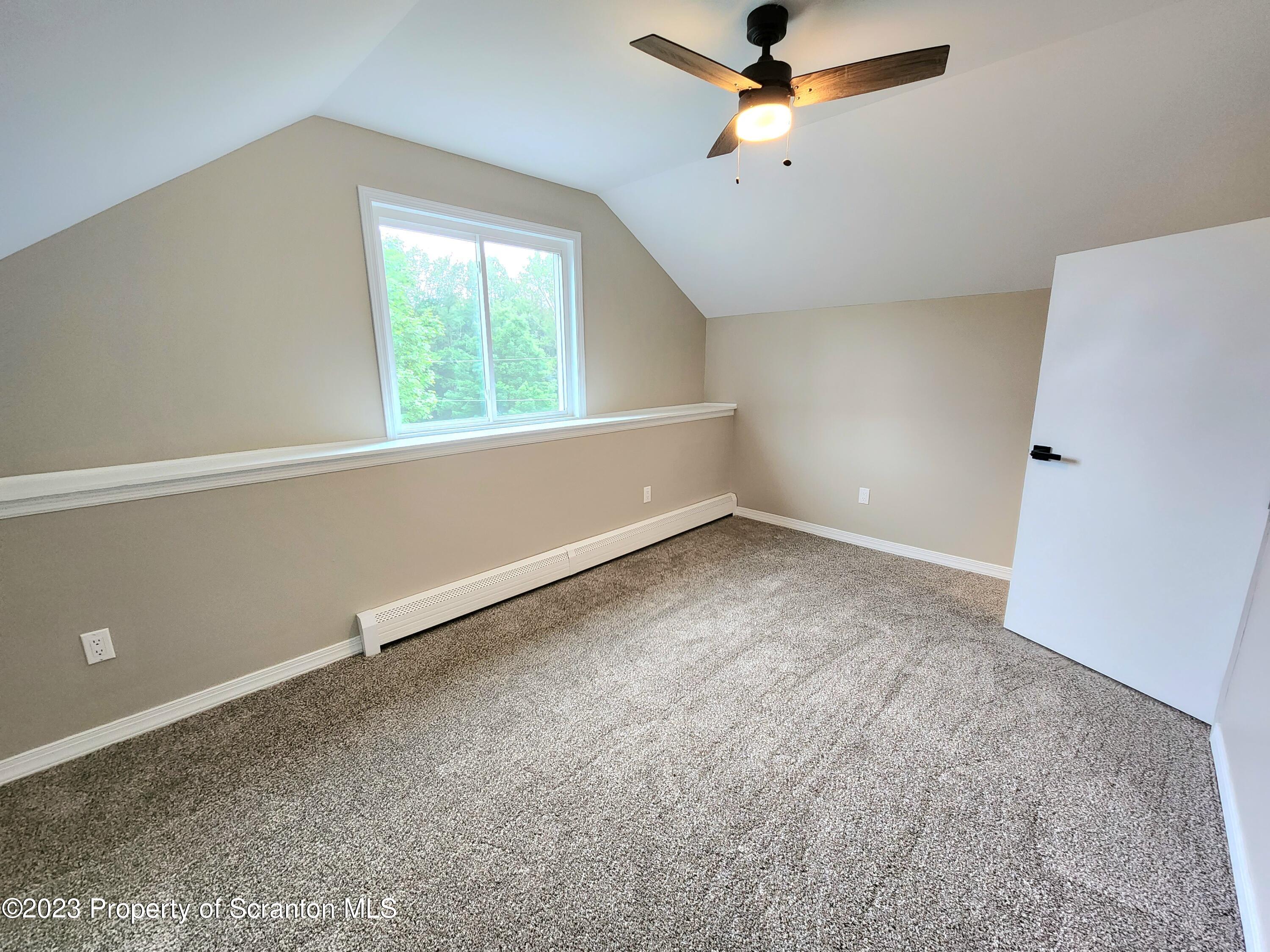 257 Maple Drive Dalton, PA 18414 - Photo 20 of 31 an empty room with a window and a fan