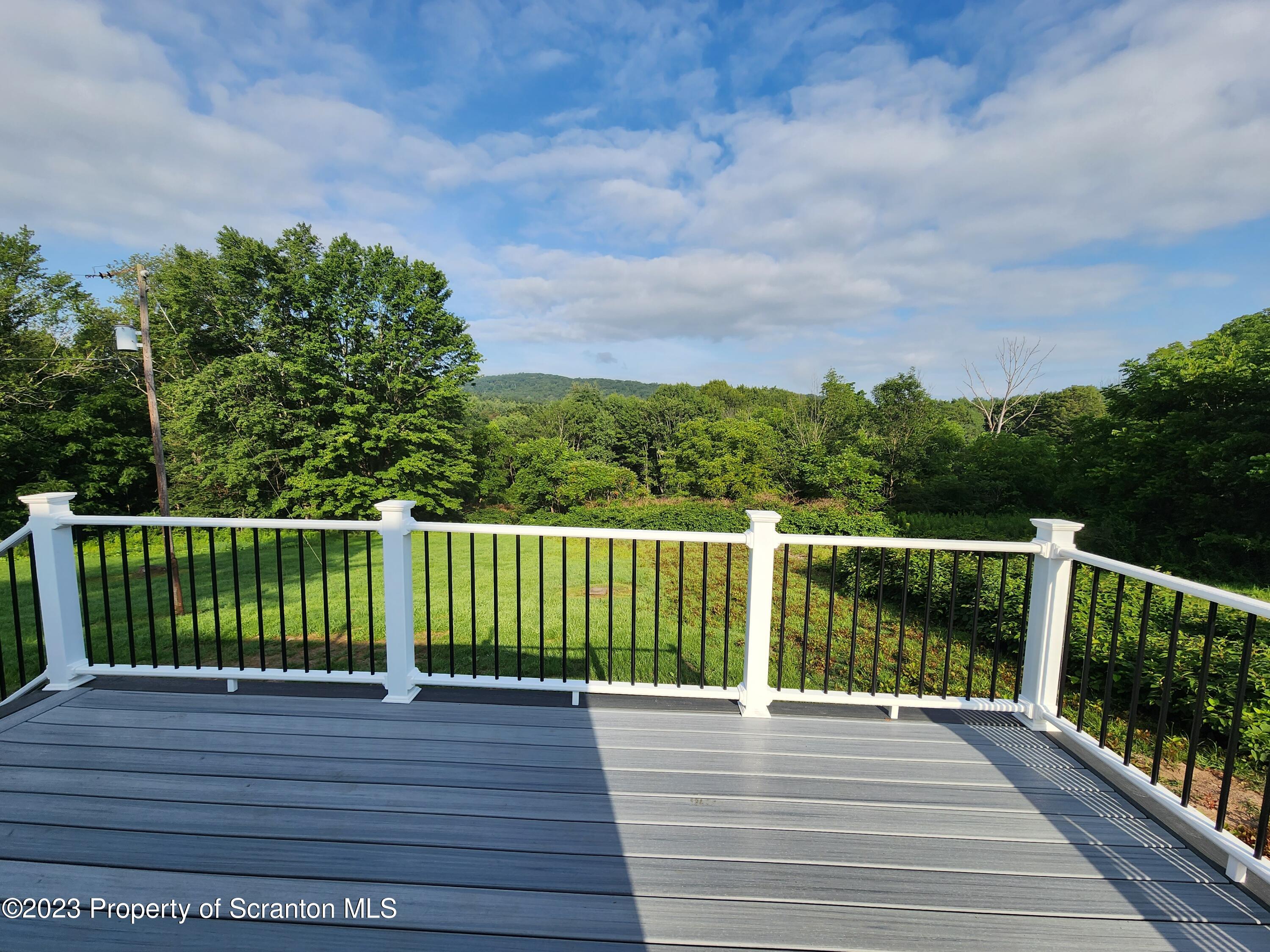 257 Maple Drive Dalton, PA 18414 - Photo 22 of 31 a view of a balcony with a yard