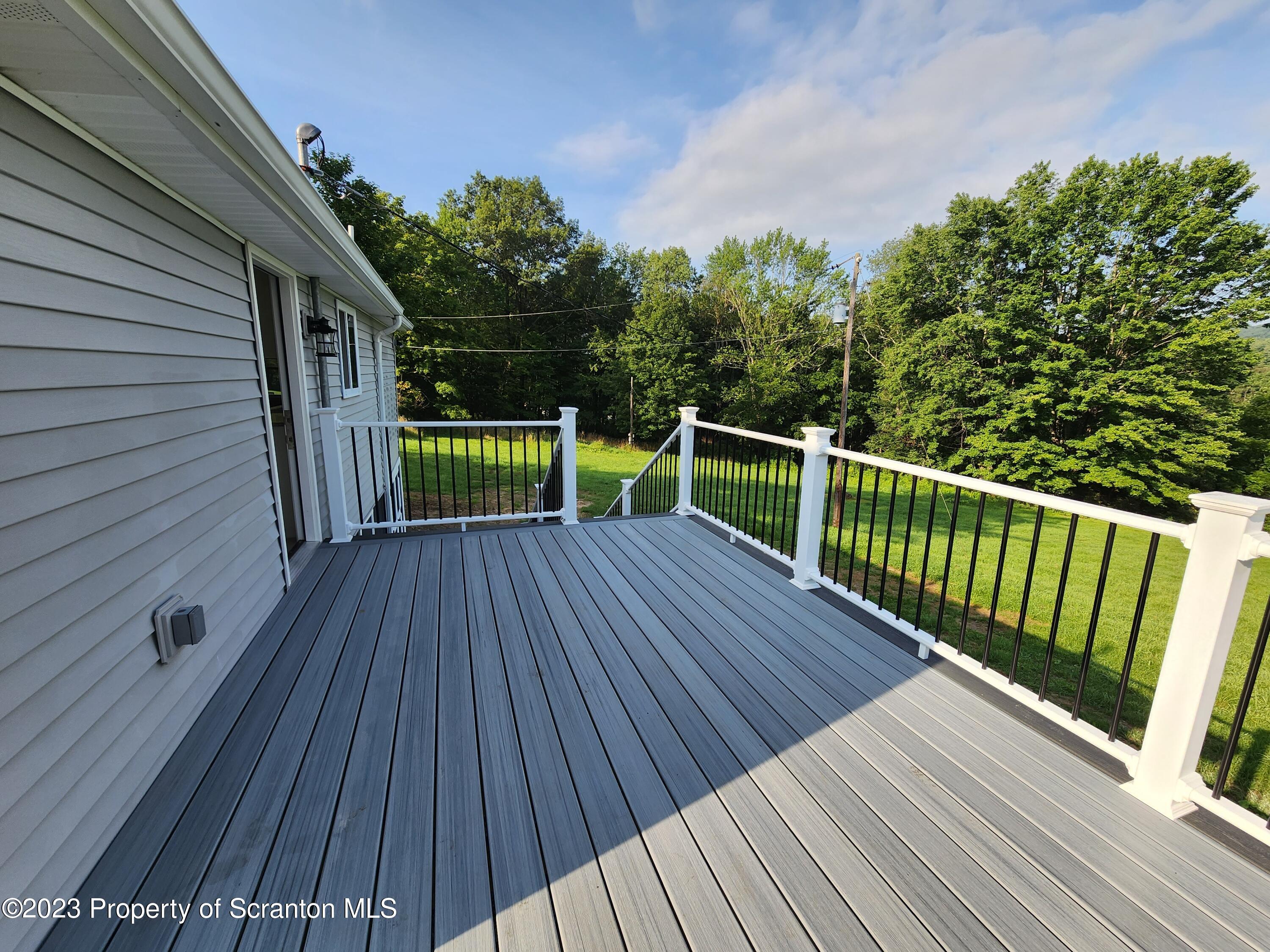 257 Maple Drive Dalton, PA 18414 - Photo 23 of 31 a view of backyard with a deck