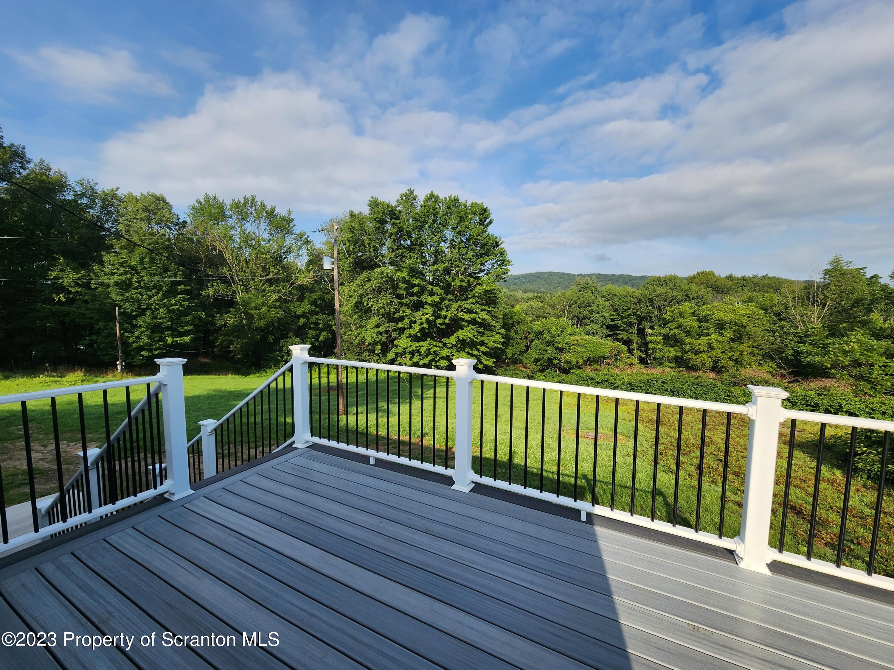 257 Maple Drive Dalton, PA 18414 - Photo 27 of 31 a view of a wooden deck