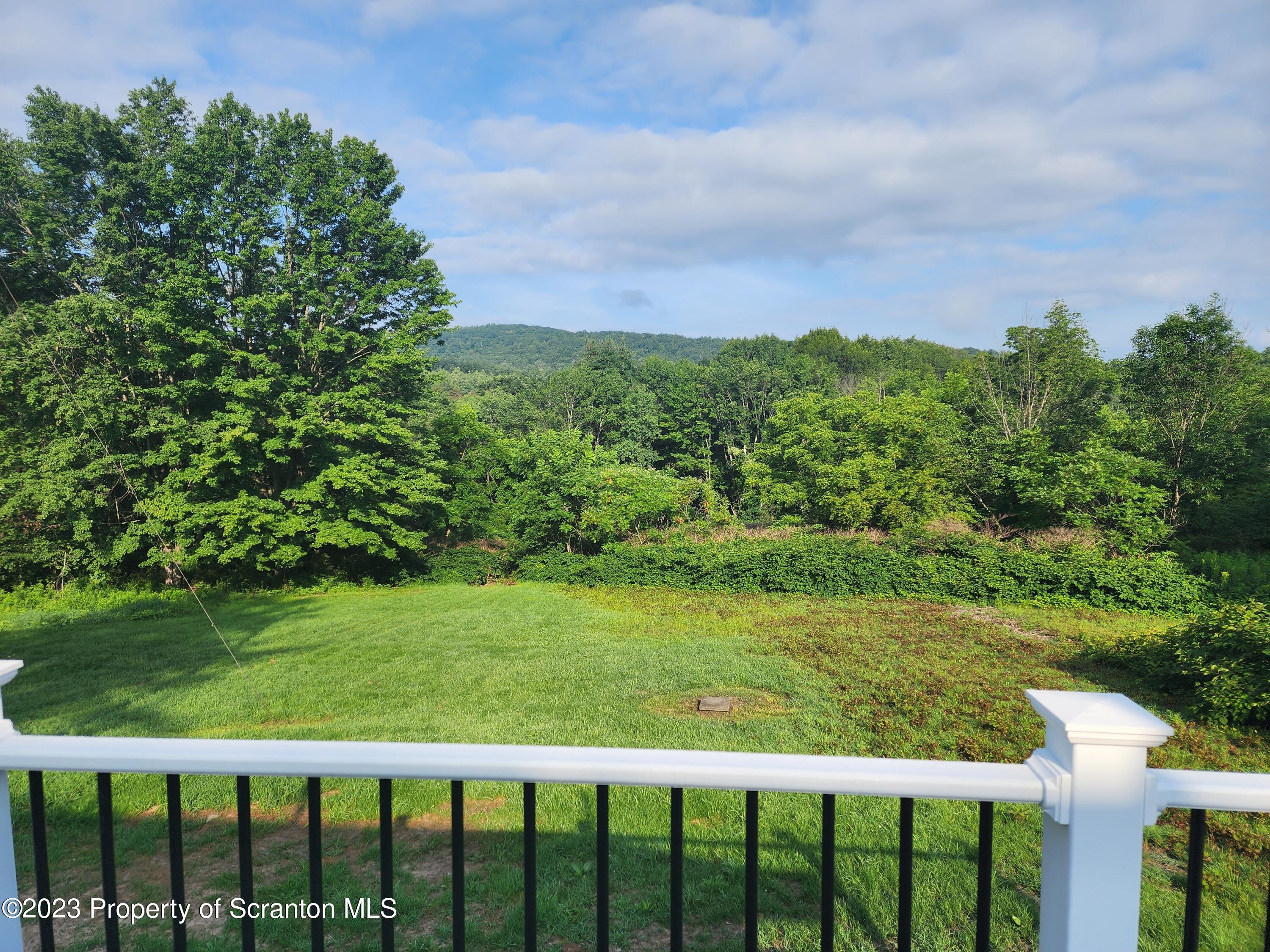257 Maple Drive Dalton, PA 18414 - Photo 28 of 31 a view of a green field with sitting space