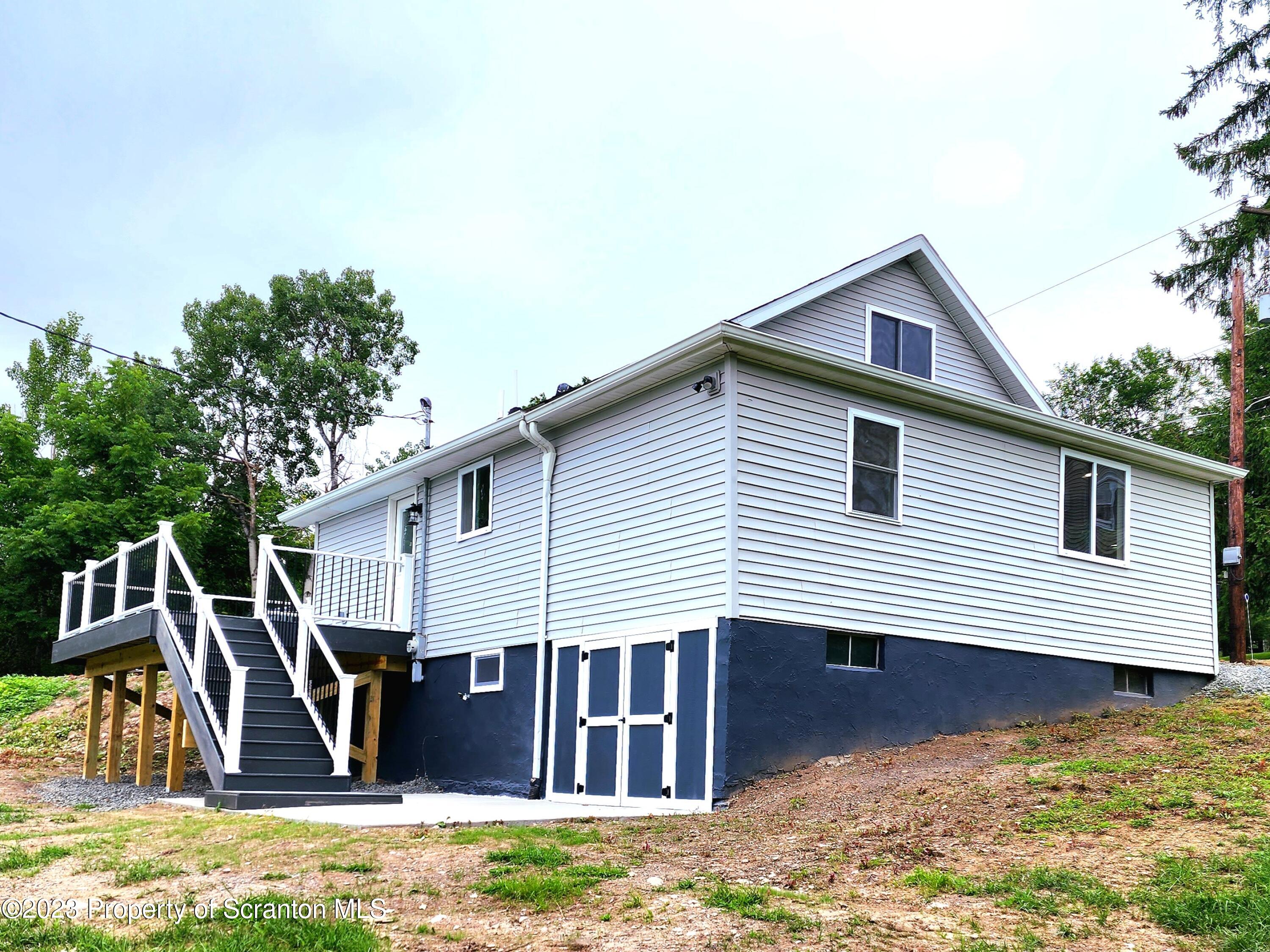 257 Maple Drive Dalton, PA 18414 - Photo 29 of 31 a view of a house with a yard