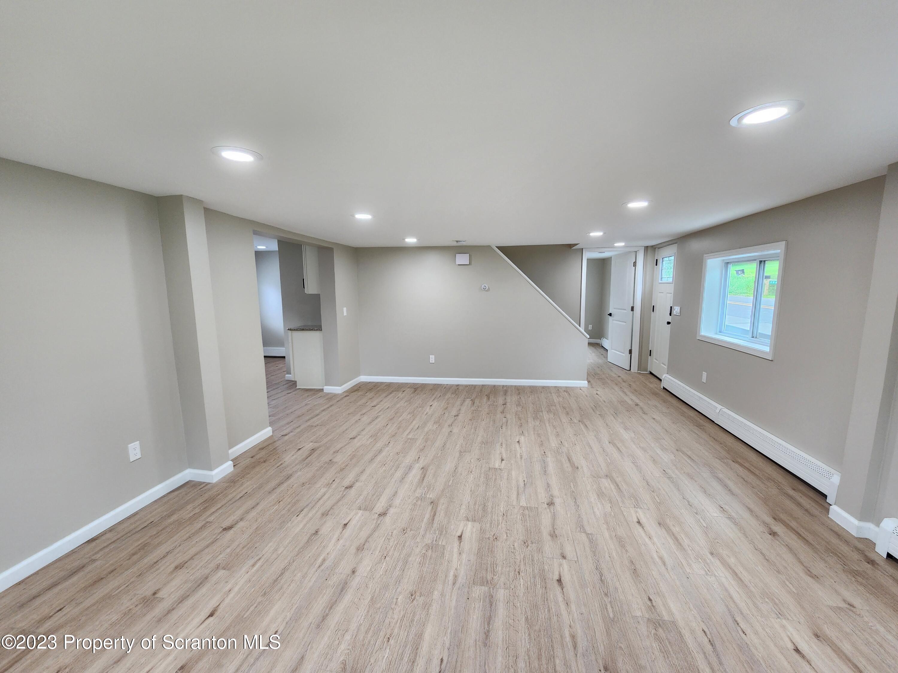 257 Maple Drive Dalton, PA 18414 - Photo 5 of 31 a view of empty room with wooden floor
