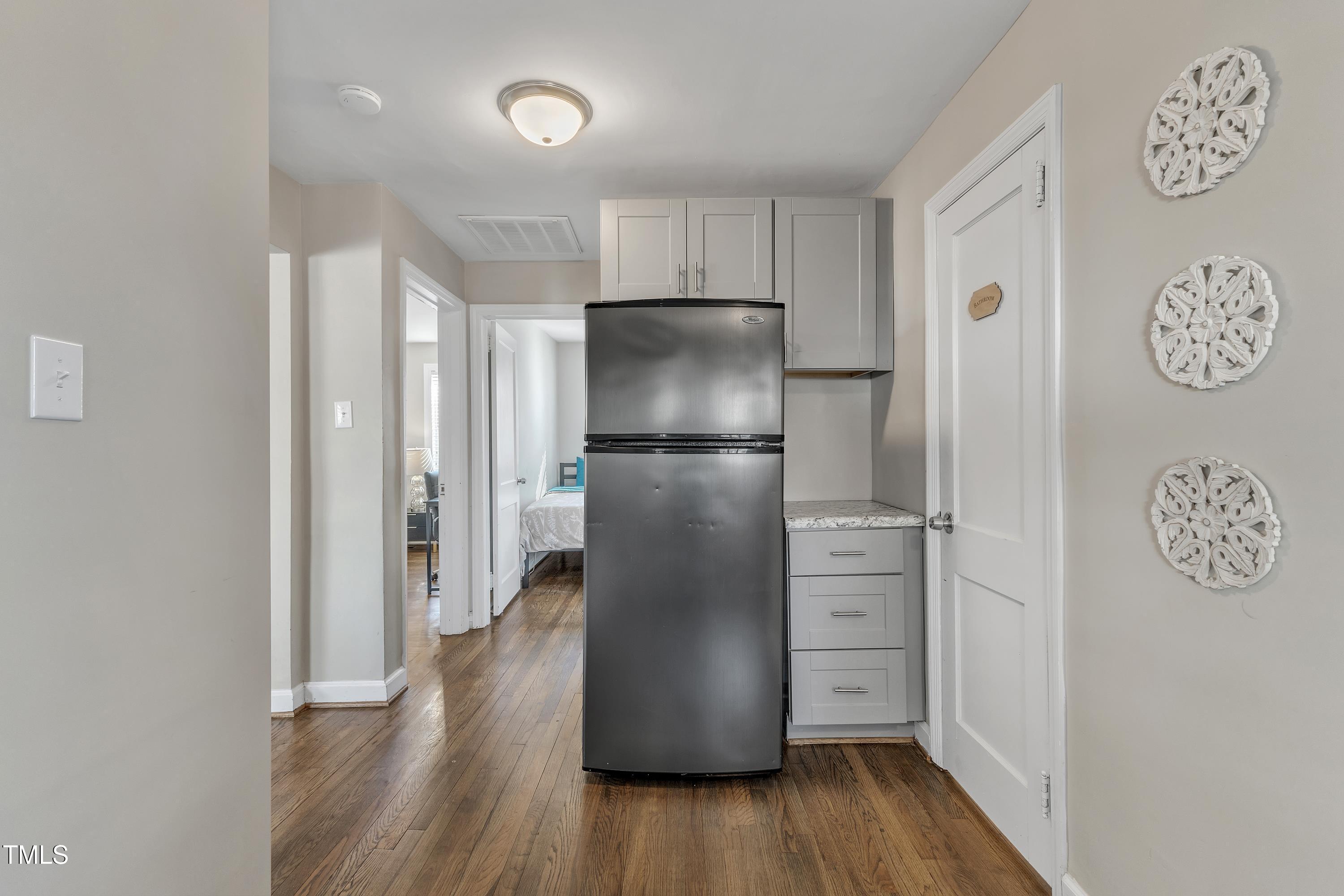 602 Quarry Street Raleigh, NC 27601 - Photo 14 of 49 a kitchen with a refrigerator and a refrigerator