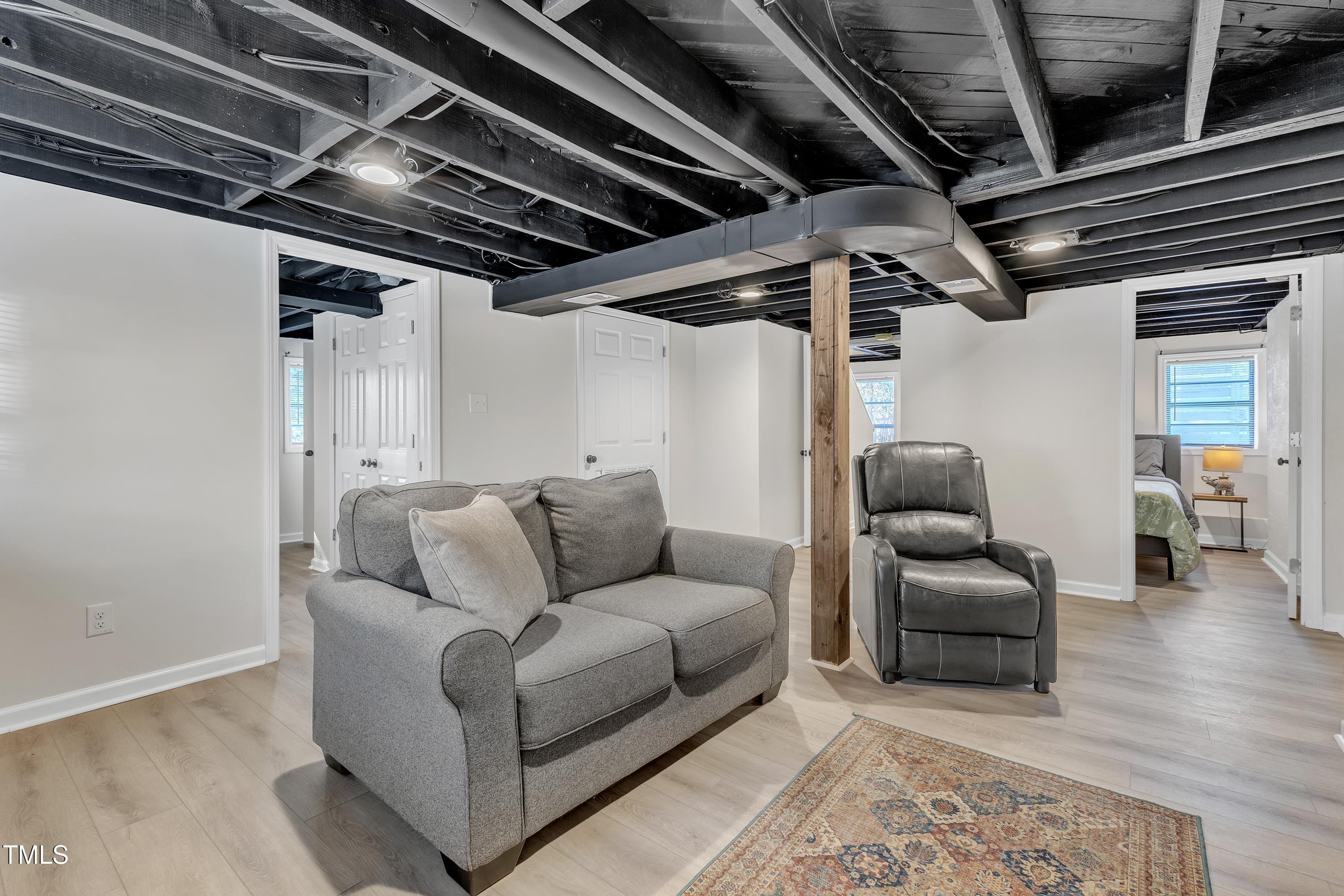 602 Quarry Street Raleigh, NC 27601 - Photo 27 of 49 a living room with furniture and a ceiling fan