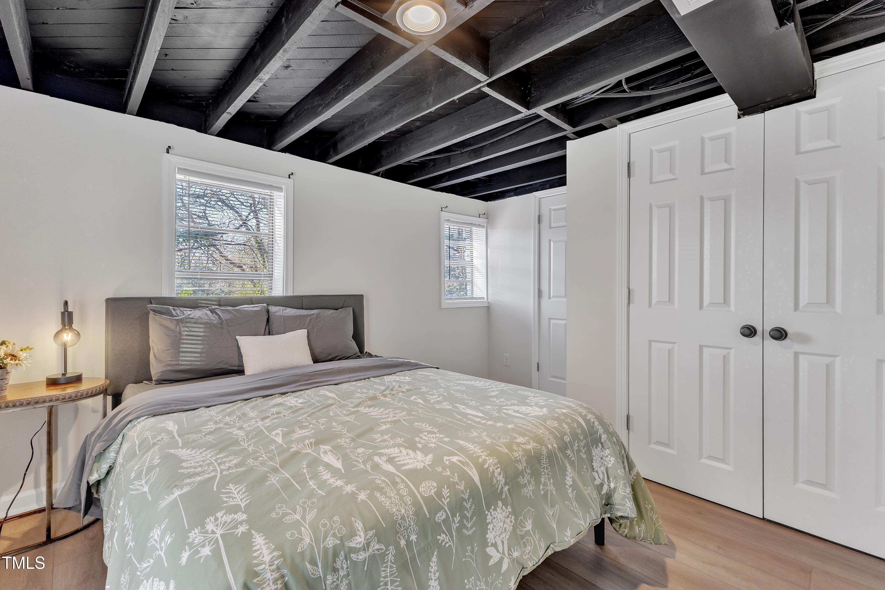 602 Quarry Street Raleigh, NC 27601 - Photo 30 of 49 a large bed in a bedroom next to a window
