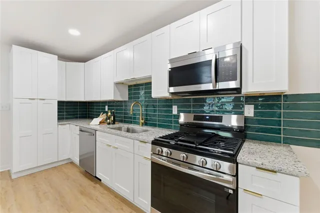 a kitchen with a stove and a microwave