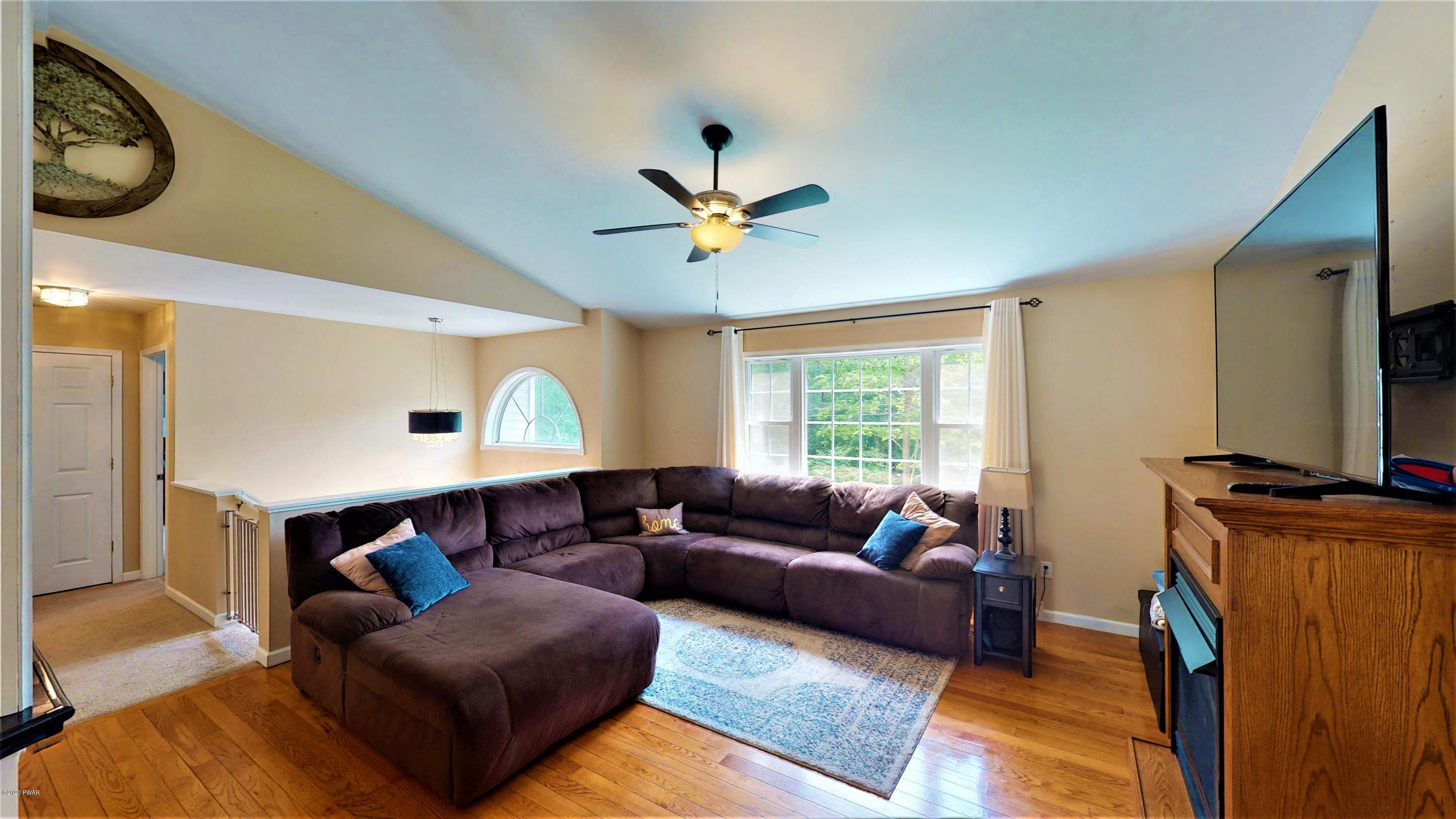 143 Raccoon Road Dingmans Ferry, PA 18328 - Photo 35 of 87 a living room with furniture and a window