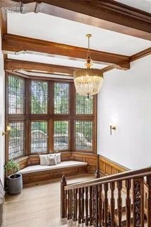 a very nice looking living room with a large window and furniture