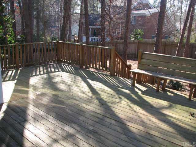 2417 Basil Drive Raleigh, NC 27612 - Photo 8 of 12 a view of a yard with wooden fence