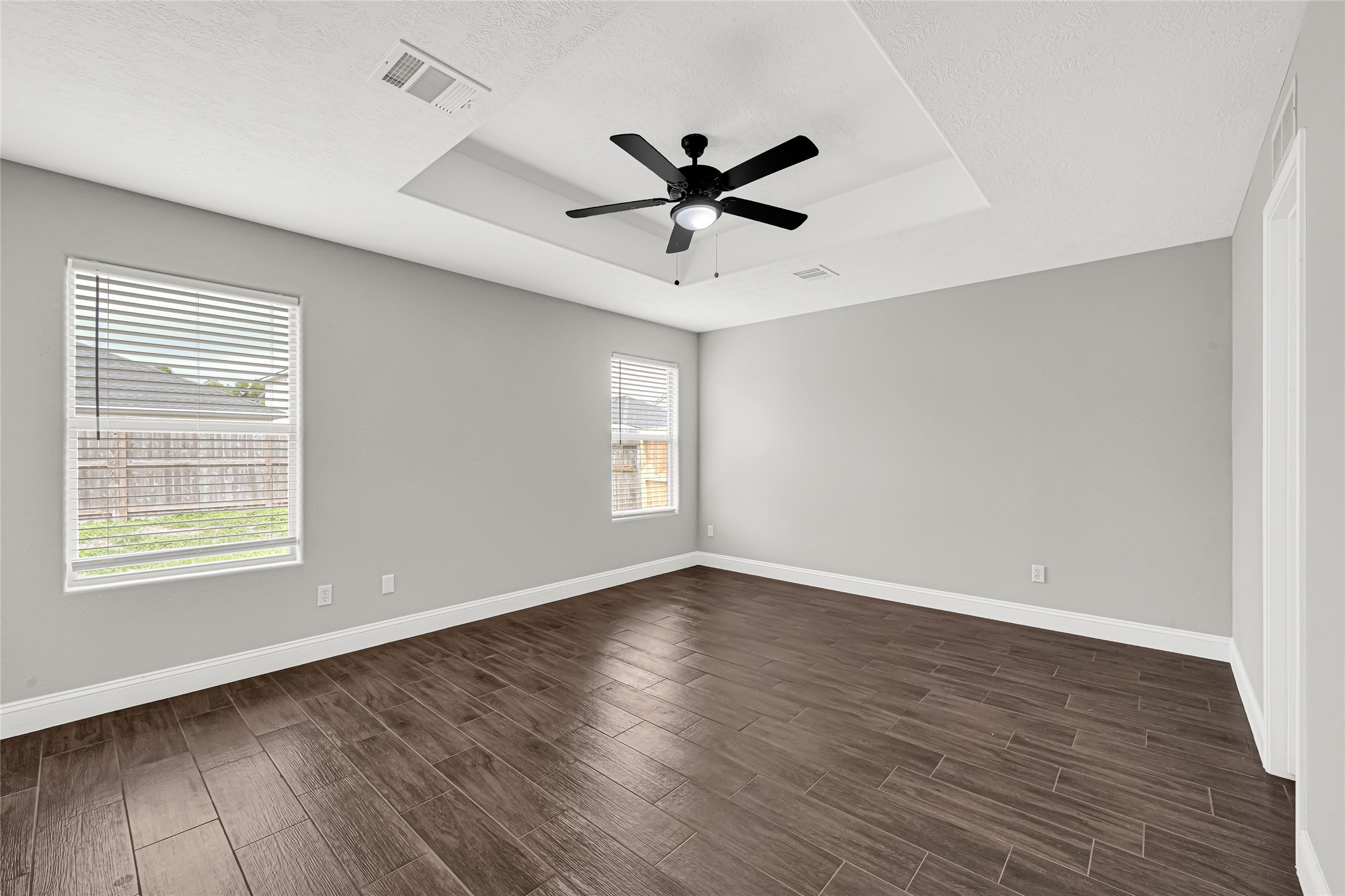 10406 Bentondale Lane Houston, TX 77075 - Photo 14 of 27 a view of an empty room with wooden floor and a window