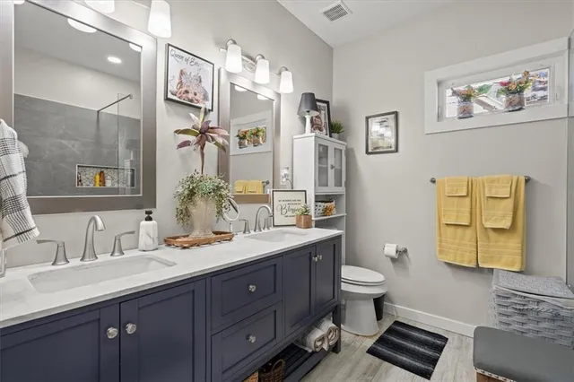 a bathroom with a toilet and shower