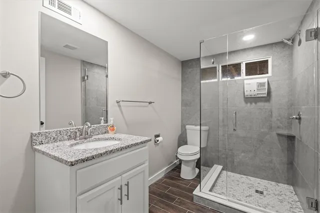 a view of a house with a backyard and a patio