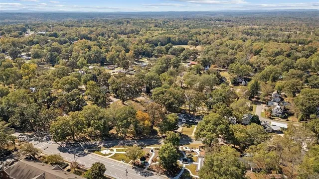 an aerial view of town with residential houses and mountain view