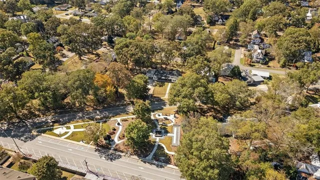 a house that has a tree in front of it