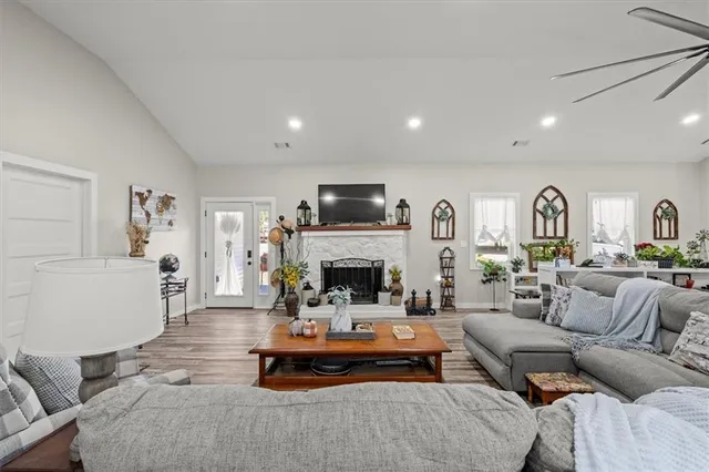 a living room with furniture fireplace and a fireplace