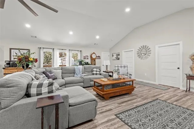 a living room with furniture and a rug