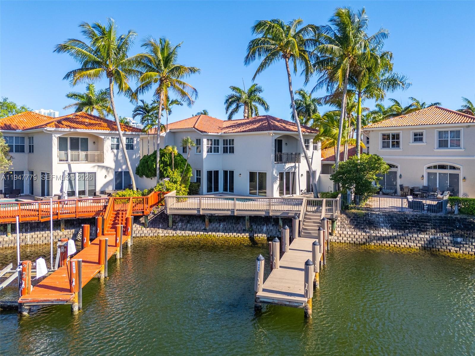 1500 Shoreline Way, Unit 1500 Hollywood, FL 33019 - Photo 2 of 54 a house with swimming pool in front of it
