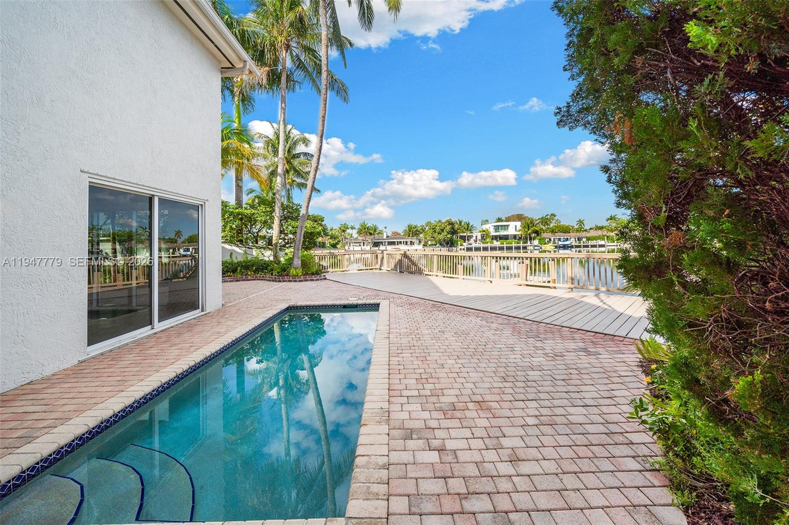 1500 Shoreline Way, Unit 1500 Hollywood, FL 33019 - Photo 44 of 54 a view of a swimming pool with a patio