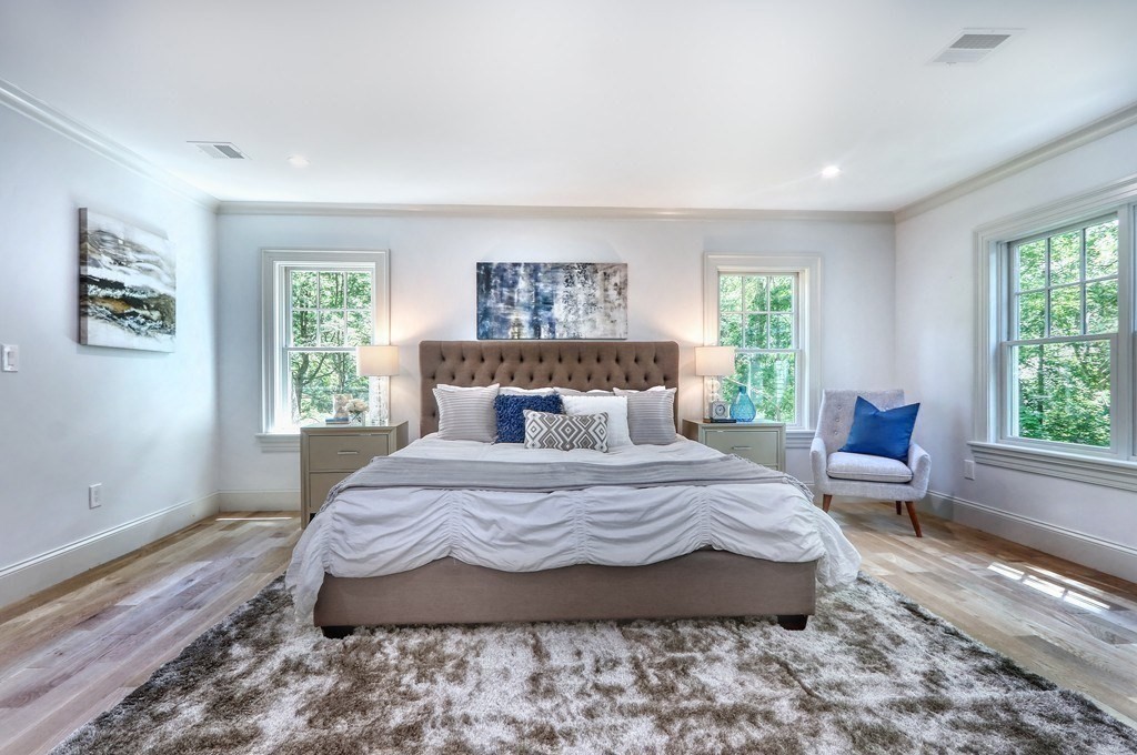 45 Widow Rights Lane Sudbury, MA 01776 - Photo 13 of 23 a bedroom with a bed and wooden floor