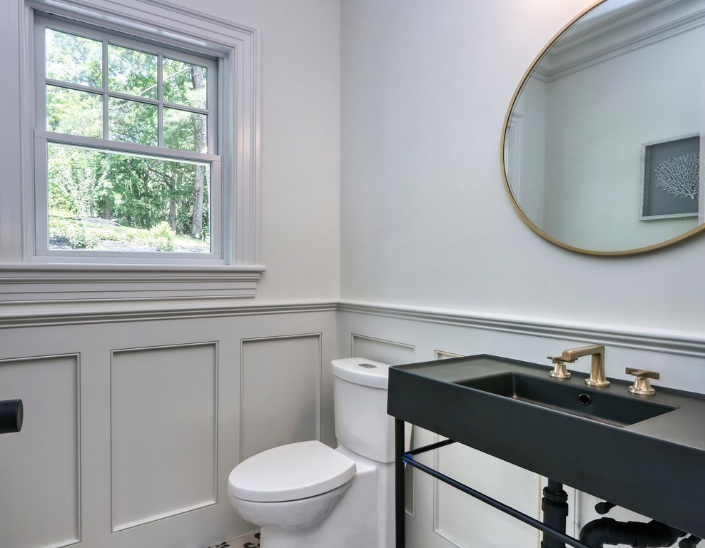 45 Widow Rights Lane Sudbury, MA 01776 - Photo 15 of 23 a bathroom with a sink a toilet and a mirror