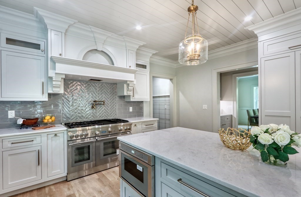 45 Widow Rights Lane Sudbury, MA 01776 - Photo 5 of 23 a kitchen with a stove and a white cabinets