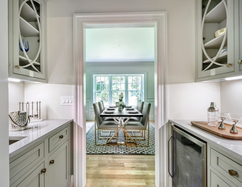 45 Widow Rights Lane Sudbury, MA 01776 - Photo 10 of 23 a dining room with kitchen island granite countertop furniture and a potted plant