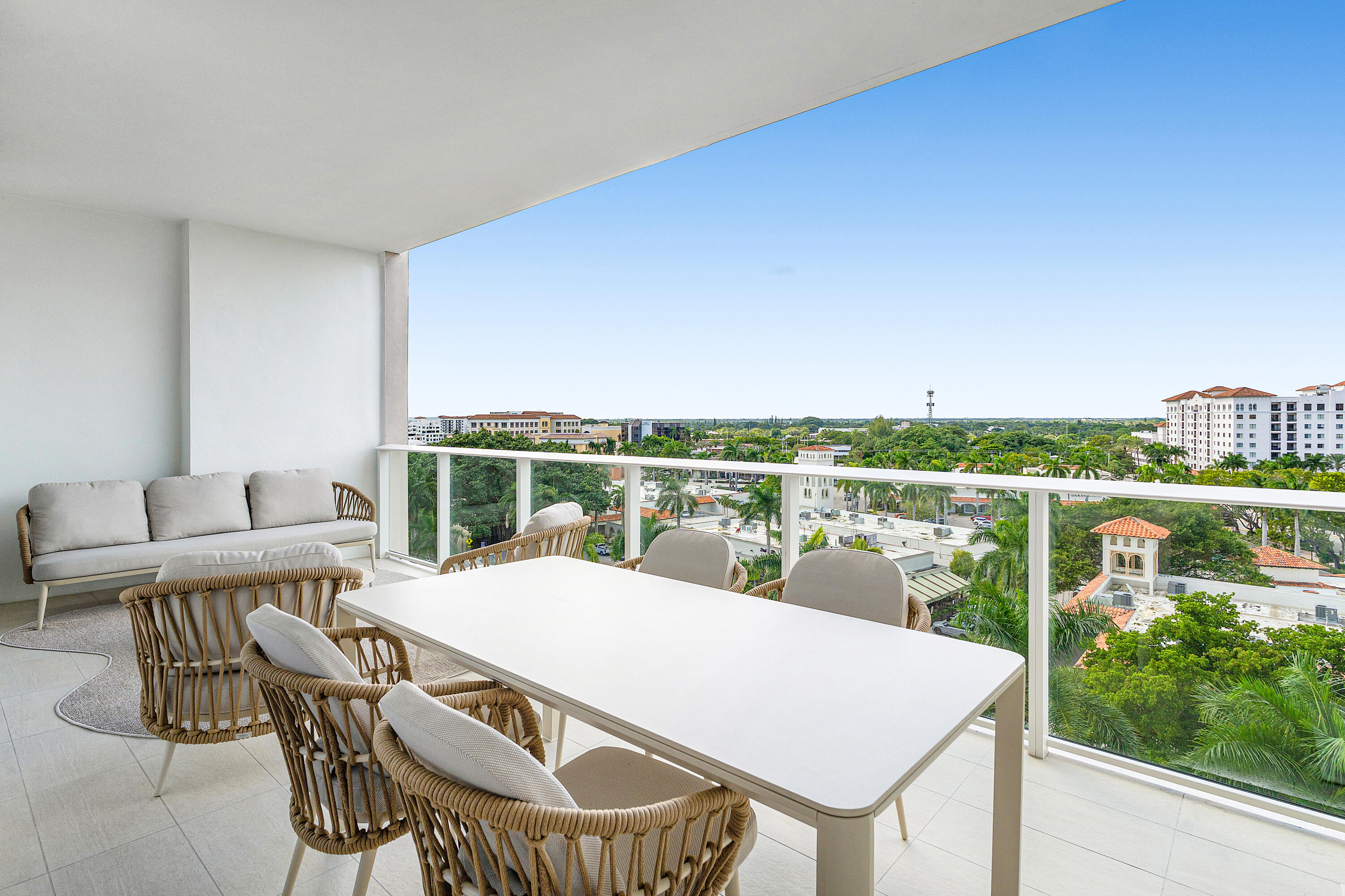 220 Southeast Mizner Boulevard, Unit 810 Boca Raton, FL 33432 - Photo 12 of 39 a view of a terrace with furniture and garden